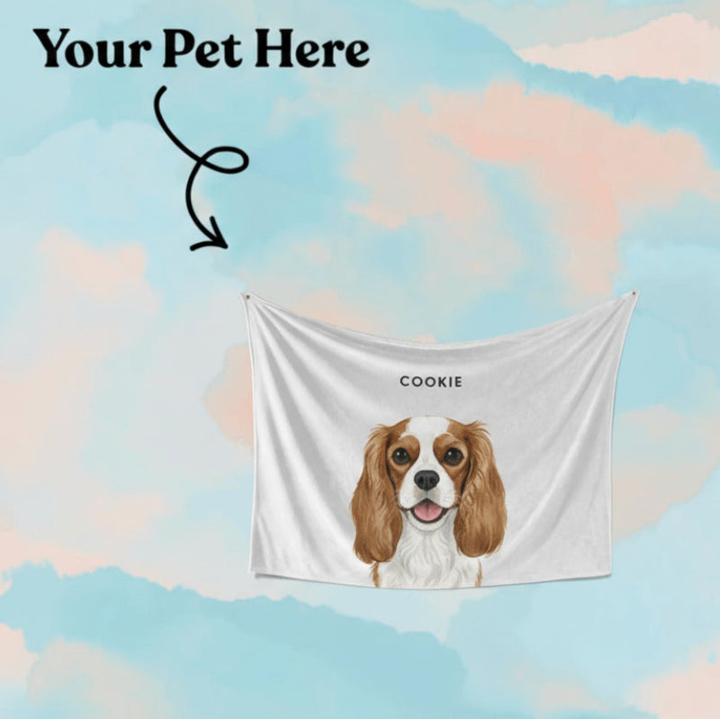 Personalized dog blanket with a dog's face on it against a colorful pastel background.